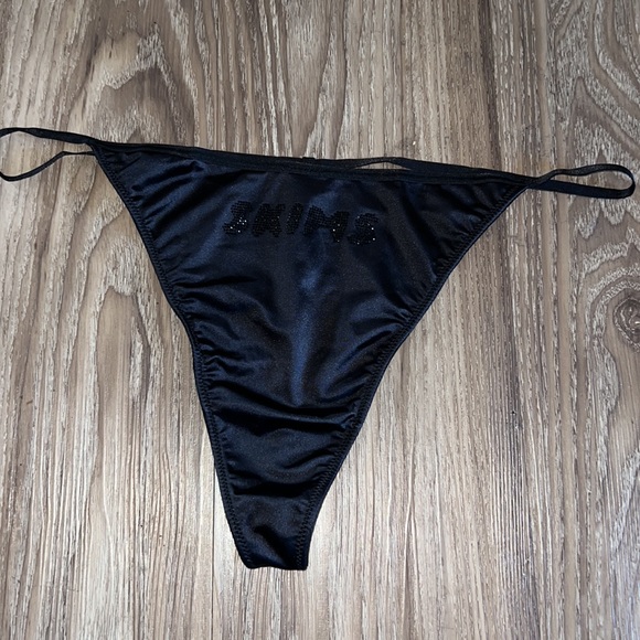 SKIMS Rhinestone Stretch Satin String thong in black - Picture 4 of 5